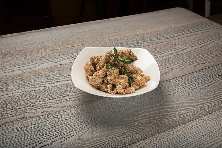 Crispy salt‑pepper fried chicken with basil leaves at P P Pop Taiwanese Noodle Restaurant, a Taiwanese Restaurant in Monterey Park